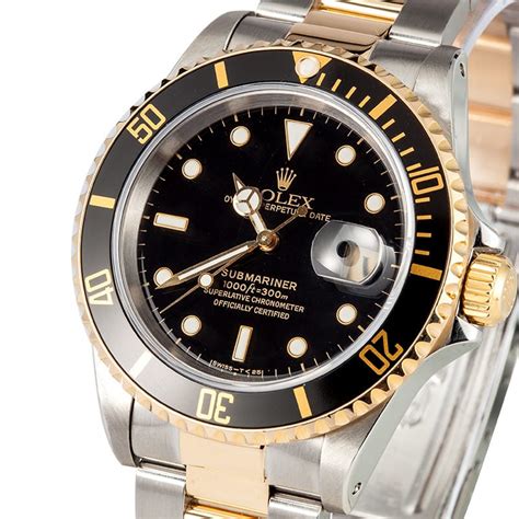 gold rolex submariner black face.